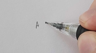 A pen drawing a point on a paper